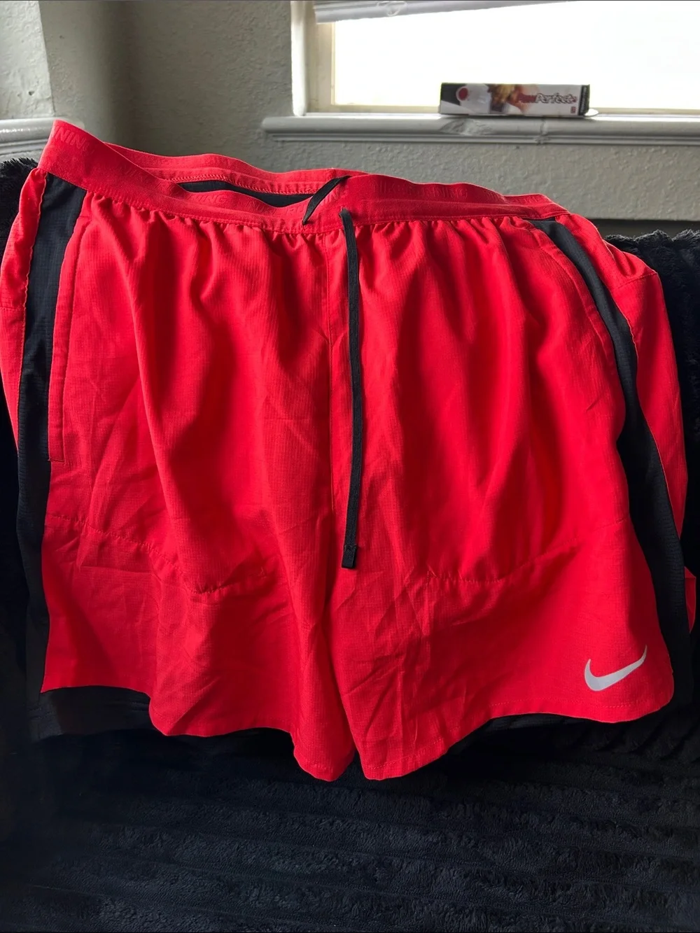 Nike Men's Red Athletic Shorts with Black Trim and White Swoosh